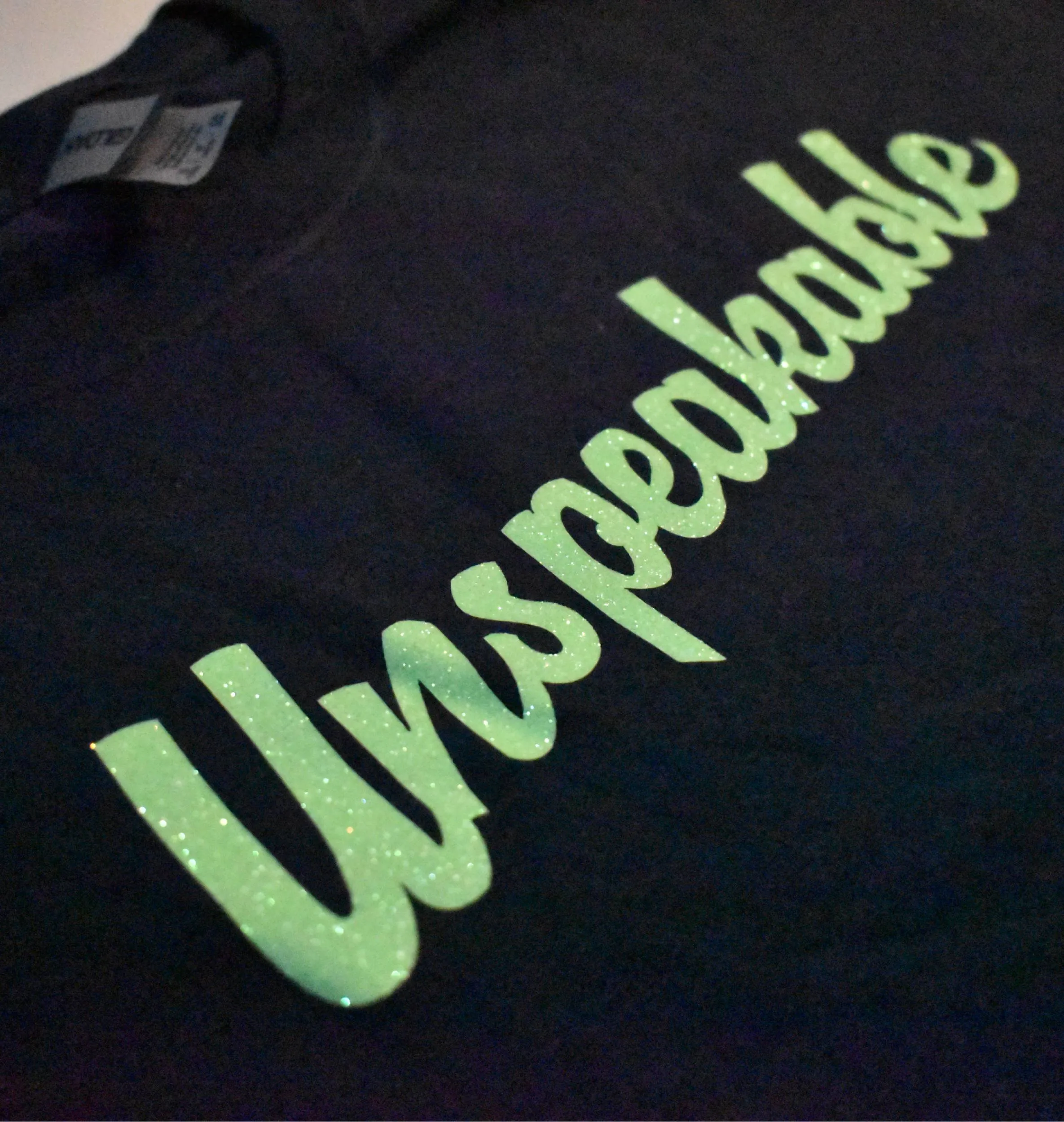 NAVY T-SHIRT W/GREEN GLITTER FONT
